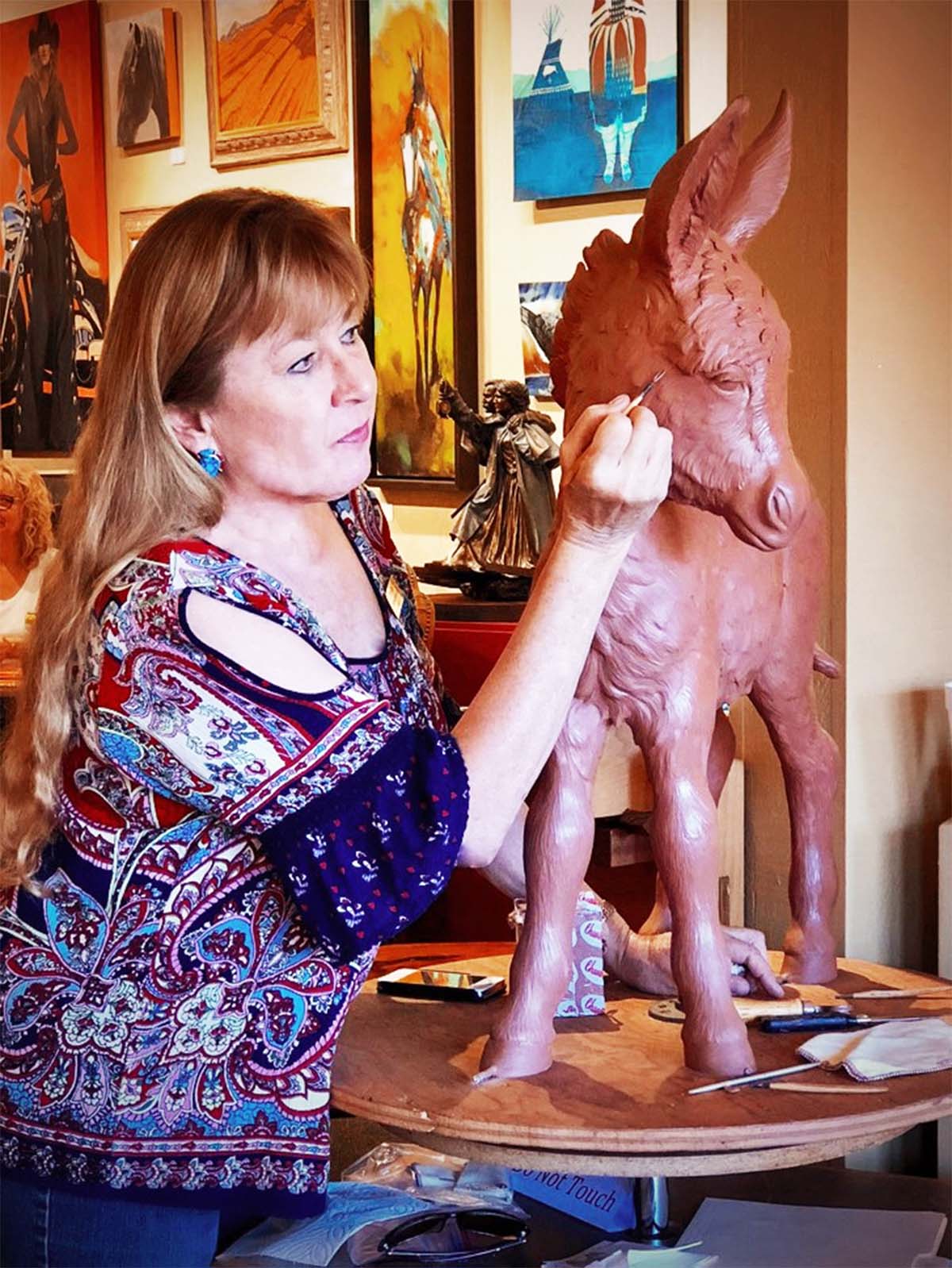 Syri Hall sculpting donkey