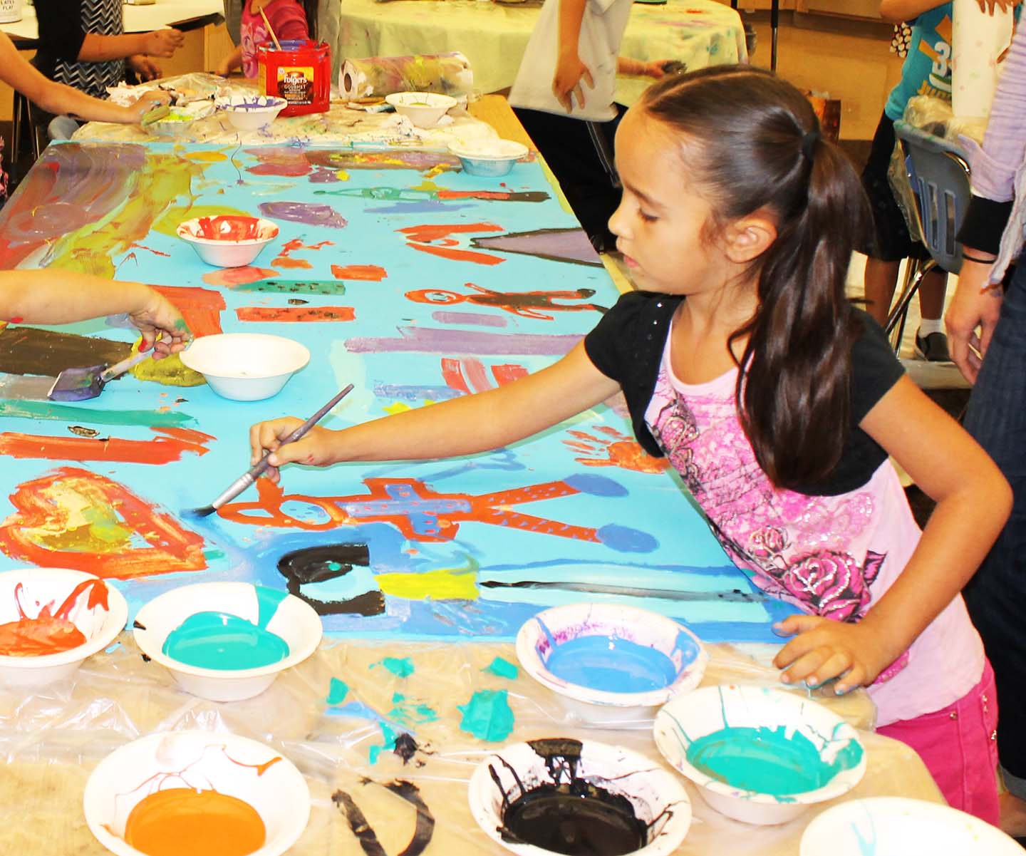 girl painting mural.jpg