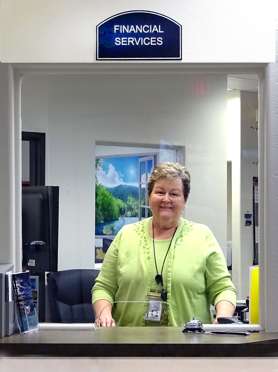 Financial Services employee at the customer counter